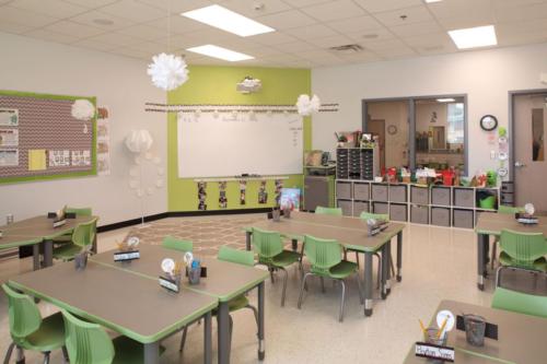 A classroom with a calming green and brown color palette