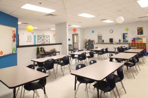 A classroom with multi-colored paper lanterns hanging from the ceiling