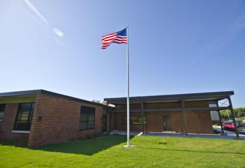 The school entrance and flagpole