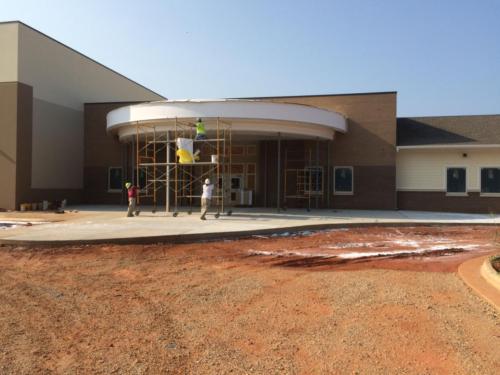 The school entrance during construction before the pillars were installed
