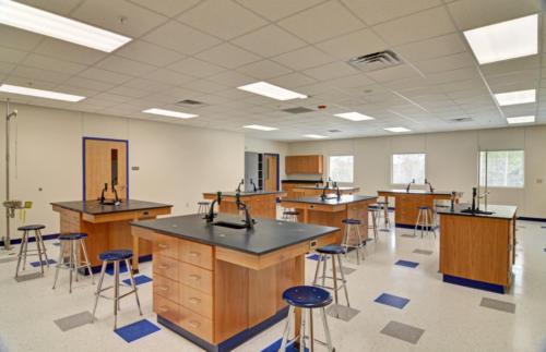 A science classroom with microscopes on the tables