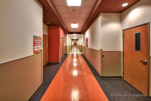 long hallway with classroom doors on both sides