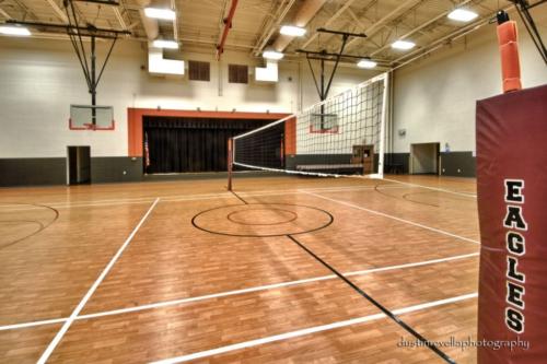 indoor gym featuring a volleyball court