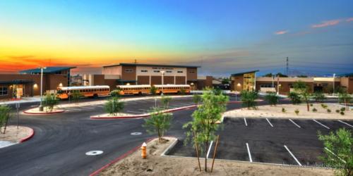 wide angle of charter school exterior and school buses
