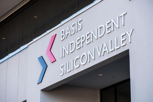 a sign reading "Basis Independent Silicon Valley" sign on school exterior