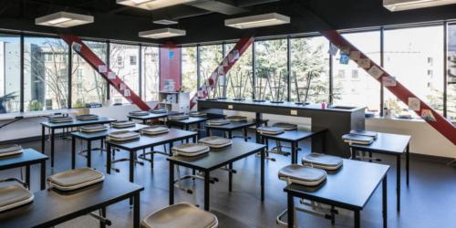 classroom with seating stacked atop the desks