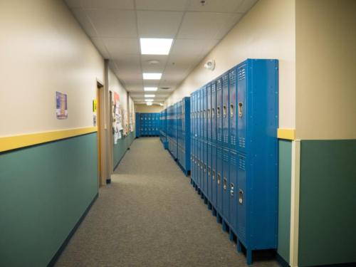 Hallway lined with lockers along one side
