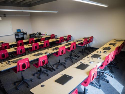 Classroom with laptops set along the desks