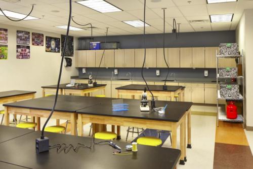 science classroom with soldering equipment and a microscope