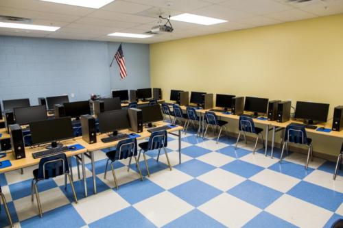 School computer lab with blue and white checkered tile floor