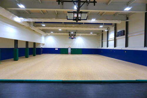 A unique school gym with columns along one wall