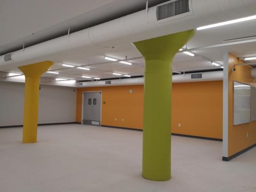 A room with large green and yellow columns