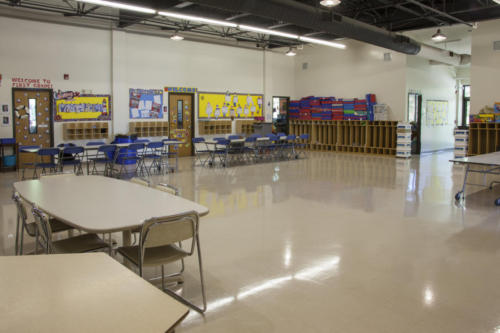 Folding tables and chairs set up in the cafeteria