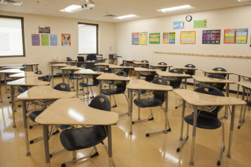 A classroom filled with triangular desks