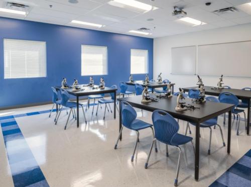 A science classroom with microscopes on the tables