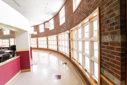 A curved hallway inside the school