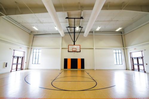 One basketball hoop inside the school gym