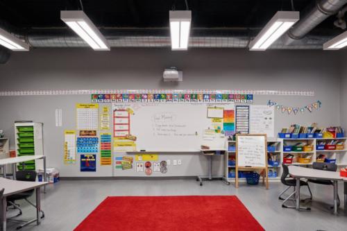 Classroom with large red area rug on the floor