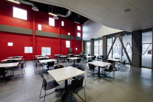A cafeteria or common area with square tables