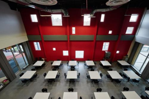 Aerial view of a cafeteria or common area with square tables