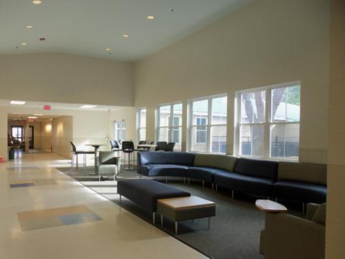 A lobby area with couches and coffee tables