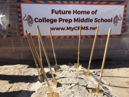several shovels sticking out of dirt at groundbreaking ceremony