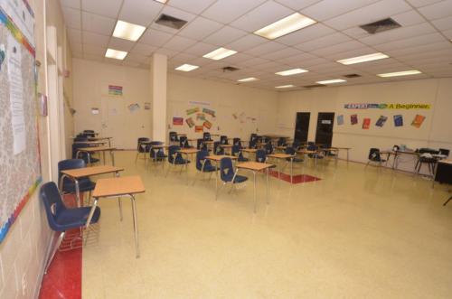 A large open classroom filled with student desks