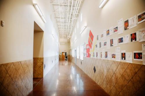 A hallway with student art hanging on the walls