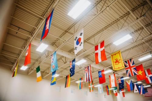 Flags from dozens of countries hanging from the ceiling 
