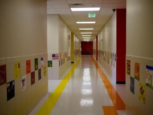 A school hallway with student art hanging on the walls