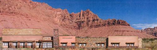 A rendering of the front of Vista Charter School with a red rock structure in the background
